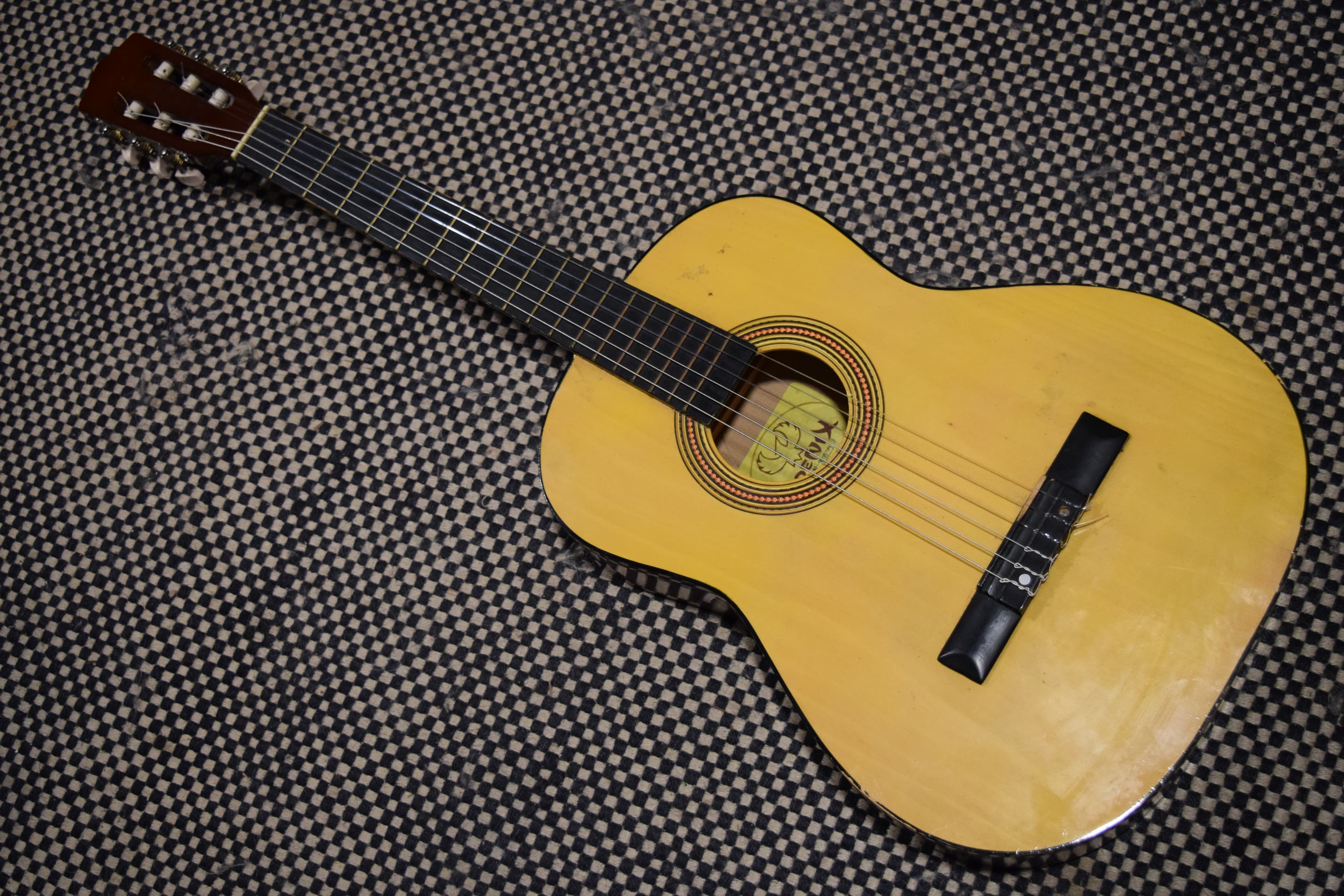 A well-worn acoustic guitar